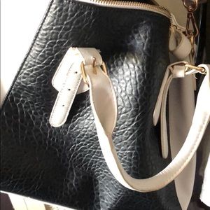 Black and white feaux leather cross body purse